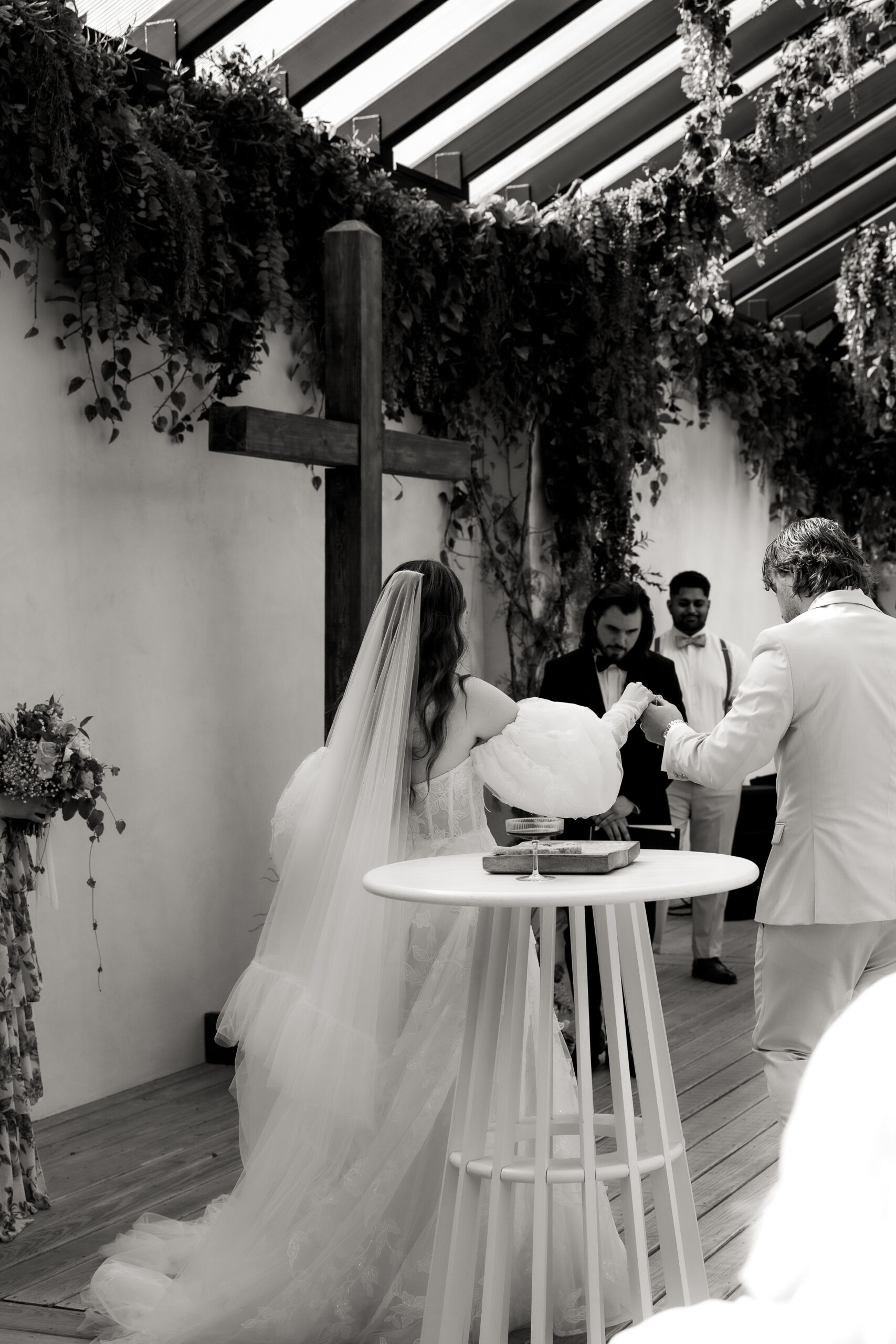 Wedding Ceremony photographed in black and white at Greenhouse Two Rivers in Springfield MO.